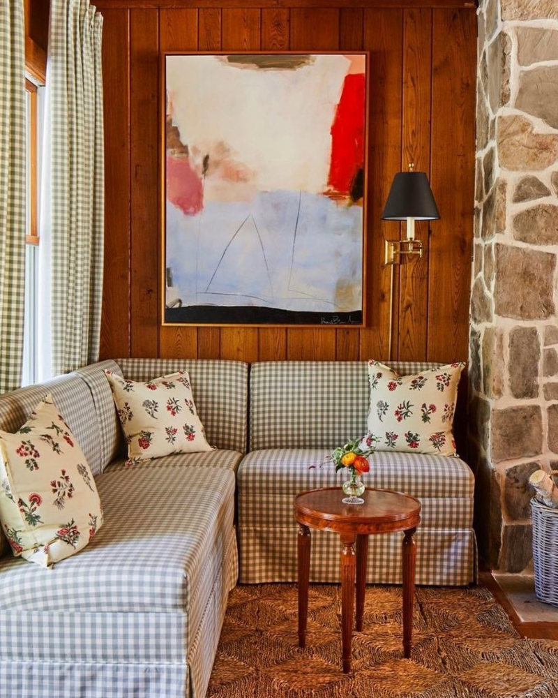 corner setee, renee buchon art and red block print pillows