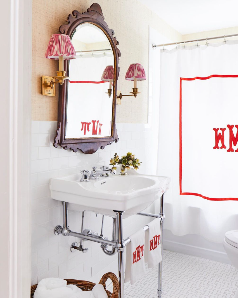 classic bathroom with red and white accessories